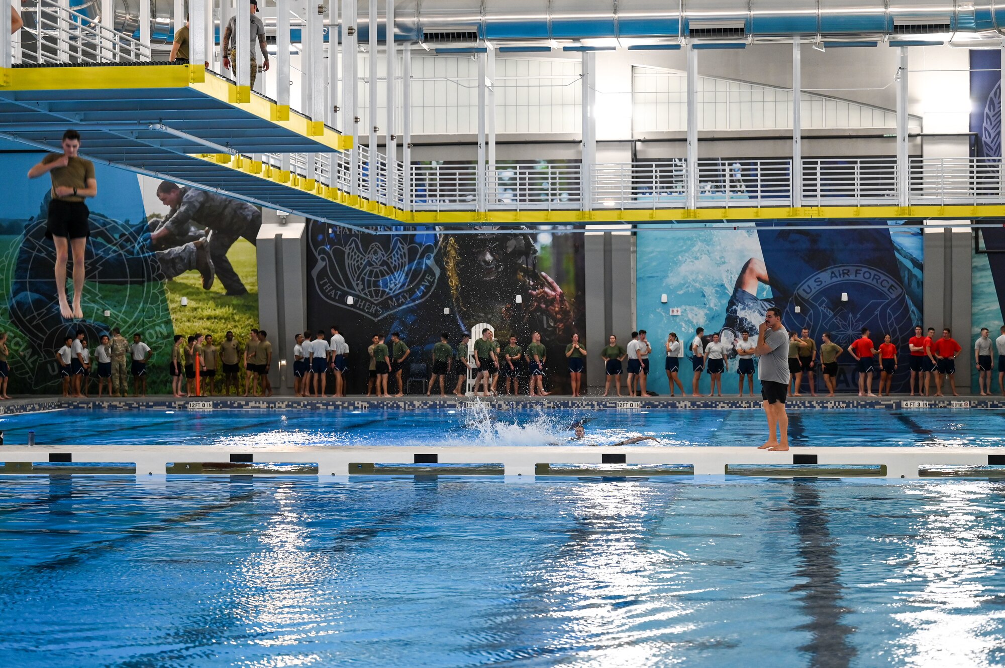 AFROTC cadets form a line before jumping into a pool