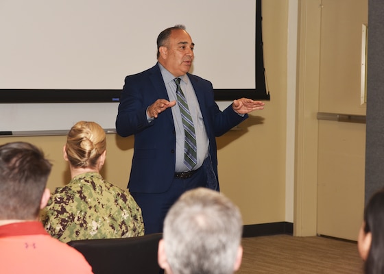 JOINT BASE SAN ANTONIO-FORT SAM HOUSTON – (Nov. 13, 2024) – Dr. Darrin Frye, of Kingman, Kan., chief science director, Naval Medical Research Unit (NAMRU) San Antonio, speaks to NAMRU San Antonio research scientists and support staff during the 10th Edition of Mission Possible, an information-sharing event, held at the Tri-Service Research Laboratory. The purpose of Mission Possible is to better inform members of the command on the tactics, techniques, and procedures of the science directorates to include the resource acquisitions and administrative directorates.  NAMRU San Antonio’s mission is to conduct gap driven combat casualty care, craniofacial, and directed energy research to improve survival, operational readiness, and safety of Department of Defense (DoD) personnel engaged in routine and expeditionary operations. It is one of the leading research and development laboratories for the U.S. Navy under the DoD and is one of eight subordinate research commands in the global network of laboratories operating under the Naval Medical Research Command in Silver Spring, Md. (U.S. Navy photo by Burrell Parmer, NAMRU San Antonio Public Affairs/Released)