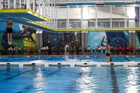 AFROTC cadets form a line before jumping into a pool