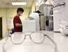 An employee in the U.S. Army Medical Materiel Center-Korea’s optical fabrication lab works on orders for new prescription glasses. USAMMC-K and its sister organization, the U.S. Army Medical Materiel Center-Europe, produce thousands of sets of eyewear for service members and their Families each month. (Photo Credit: Ellen Crown)