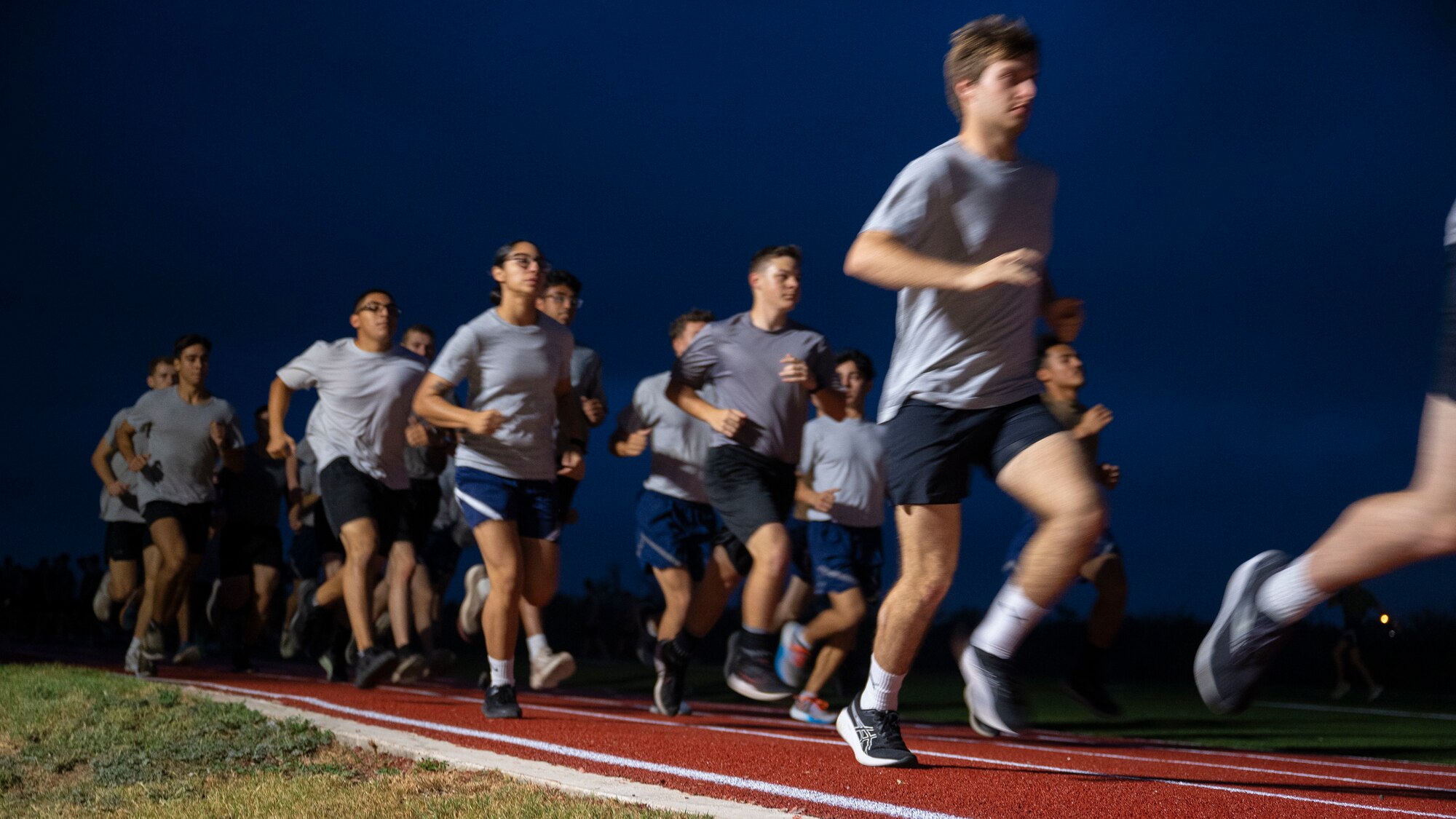 AFROTC cadets run on a track in a 2 mile race
