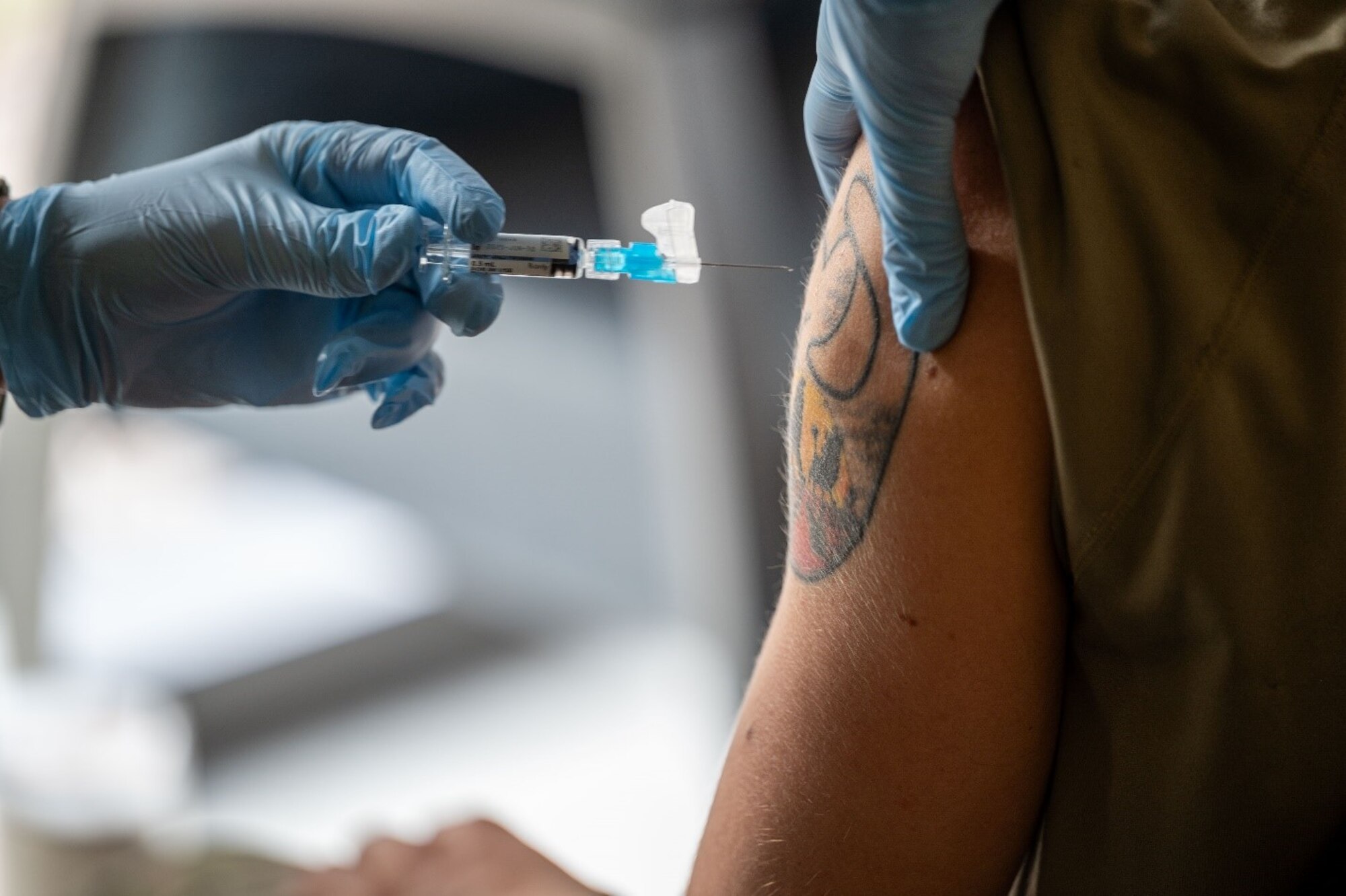 Nurse administers flu vaccine to Airman. (U.S. Air Force photo by Airman Donnell Ramsey)