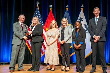 (241107-N-HL559-0109) WASHINGTON – The Streamlined Growth Management Process contracting team (center), one of seven Naval Sea Systems Command (NAVSEA) acquisition professionals was recognized Nov. 8 at the Pentagon for outstanding acquisition practices during the 2024 Department of the Navy Acquisition Excellence Awards ceremony.