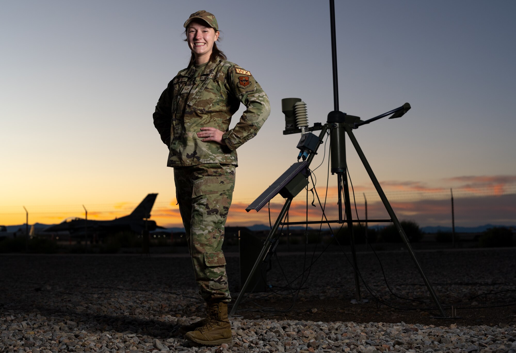 U.S. Air Force Senior Airman Megan Bivins, 54th Operational Support Squadron weather journeyman, poses for a portrait at Holloman Air Force Base, New Mexico, Nov. 5, 2024. Her job as a weather journeyman includes tasks such as weather forecasting, analysis, operations management and briefings with pilots on the installation. (U.S. Air Force photo by Senior Airman Antonio Salfran)