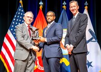(241107-N-HL559-0220) WASHINGTON – Mr. Jordan A. Scott (center), one of seven Naval Sea Systems Command (NAVSEA) acquisition professionals was recognized Nov. 8 at the Pentagon for outstanding acquisition practices during the 2024 Department of the Navy Acquisition Excellence Awards ceremony