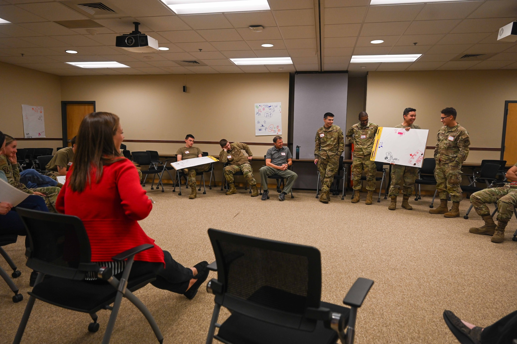 Airmen from the 22nd Air Refueling Wing present their vision board during the Wingman Guardian Connect class Oct. 22, 2024, at McConnell Air Force Base, Kansas. The Wingman Guardian Connect program aims to help with communication and support for Airmen and Guardians who face issues such as loneliness, stressors and lack of community. This is the first week of its integration and has been held for First Term Enlisted Course and maintenance Airmen. (U.S. Air Force photo by Senior Airman William Lunn)