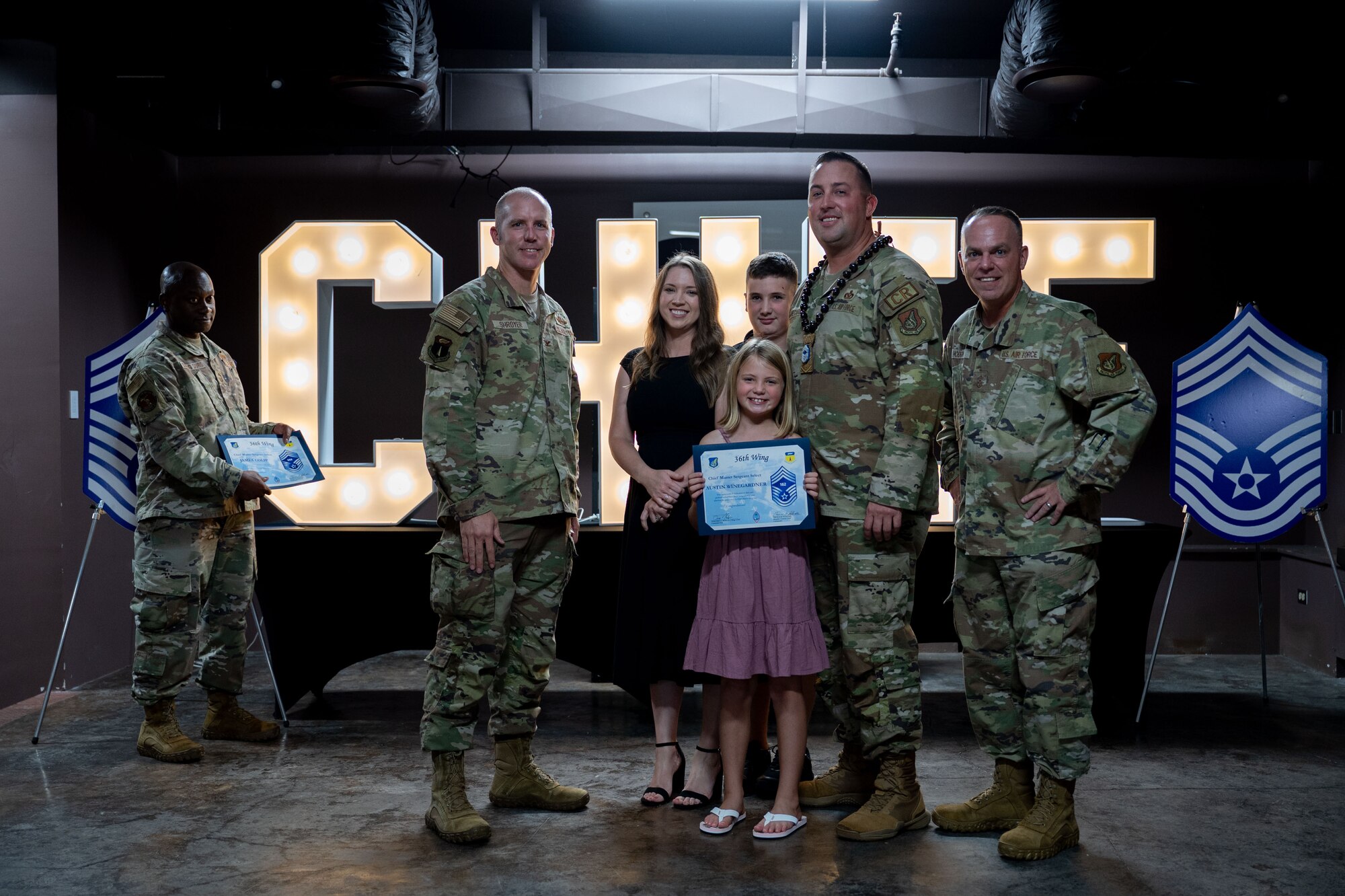 Team Andersen celebrates new Chief Master Sgt. selects during a chief release party at Andersen Air Force Base, Guam, Nov. 14, 2024. Chief master sergeant is the highest enlisted rank, making up 1 percent of the enlisted Air Force. (U.S. Air Force photo by Airman 1st Class Audree Campbell)