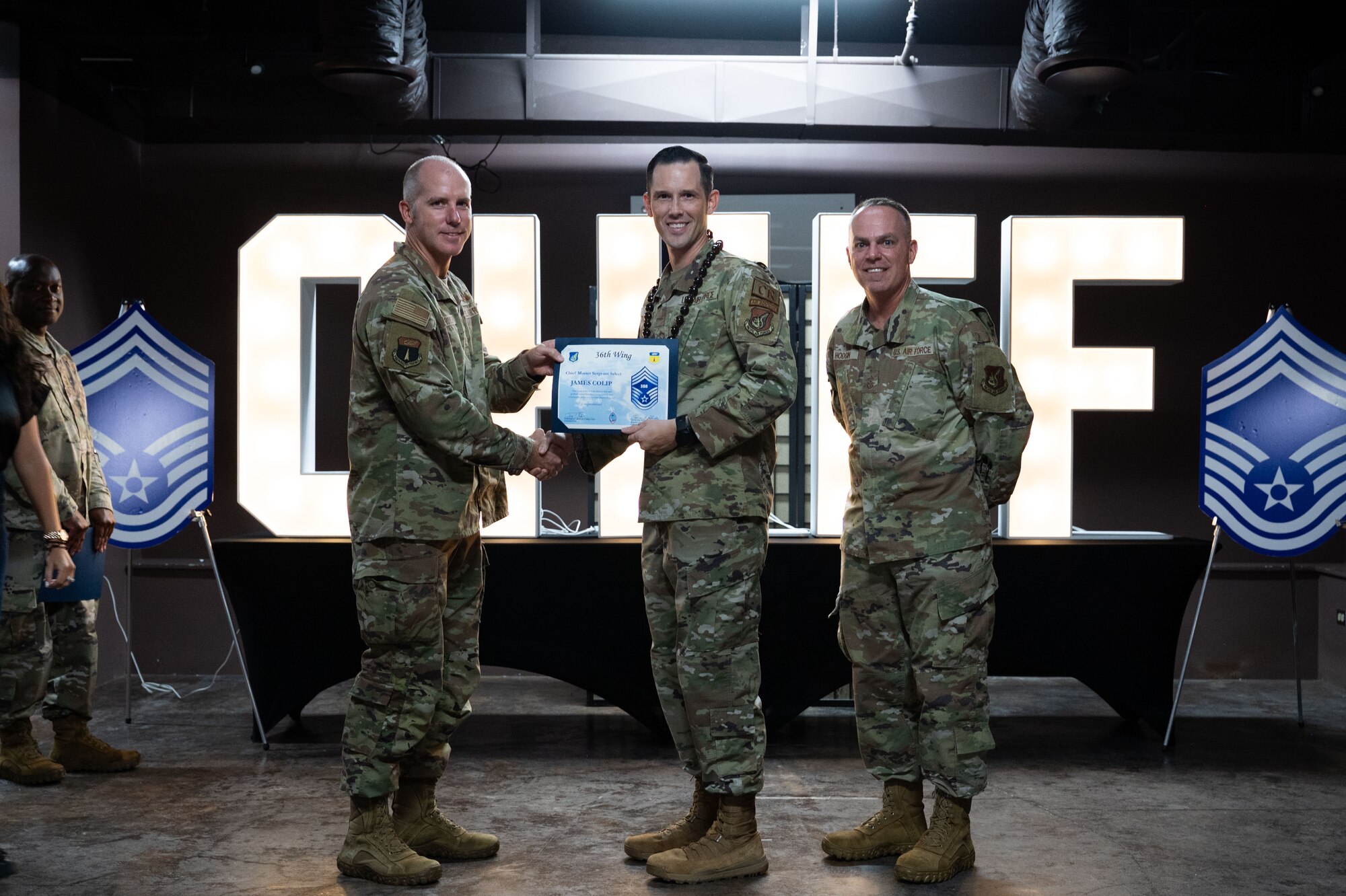 Team Andersen celebrates new Chief Master Sgt. selects during a chief release party at Andersen Air Force Base, Guam, Nov. 14, 2024. Chief master sergeant is the highest enlisted rank, making up 1 percent of the enlisted Air Force. (U.S. Air Force photo by Airman 1st Class Audree Campbell)