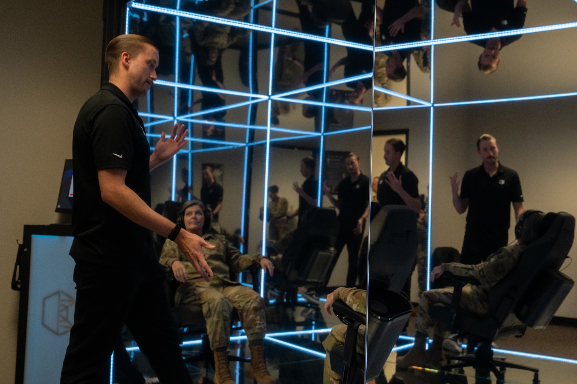 Brandon Murphy, Lumena head of growth, prepares U.S. Air Force Col. Tiffany Feet, 317th Maintenance Group commander, for a MindGym session at Dyess Air Force Base, Texas, Nov. 13, 2024. The MindGym was installed at Dyess as a resource for base personnel to strengthen their mental focus. (U.S. Air Force photo by Senior Airman Alondra Cristobal Hernandez)