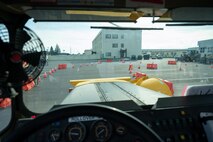 A rollover plow overlooks the Snow Rodeo course