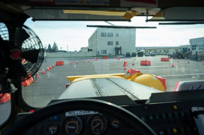 A rollover plow overlooks the Snow Rodeo course