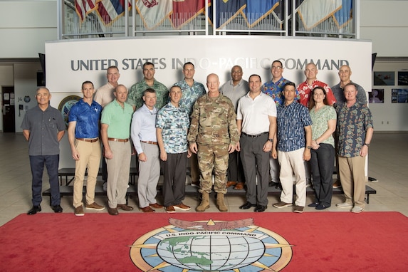 U.S. Air Force Maj. Gen. Joel Carey, chief of staff for U.S. Indo-Pacific Command, center, retired Adm. Harry Harris, former U.S. ambassador to South Korea and the 24th USINDOPACOM commander, and National Defense University CAPSTONE fellows pose for a group photo at USINDOPACOM headquarters on Camp H.M. Smith, Hawaii, Nov. 13, 2024.