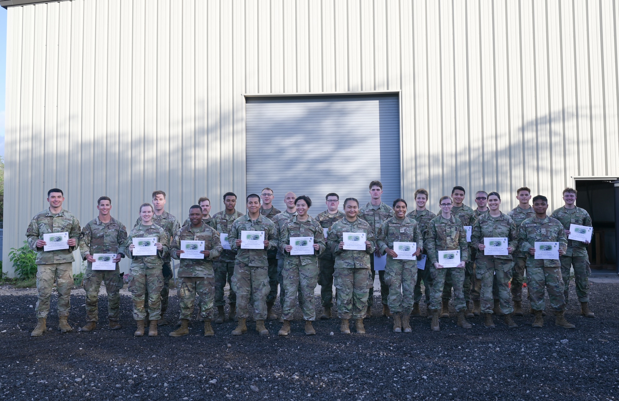 Airmen stand in formation during a photo.