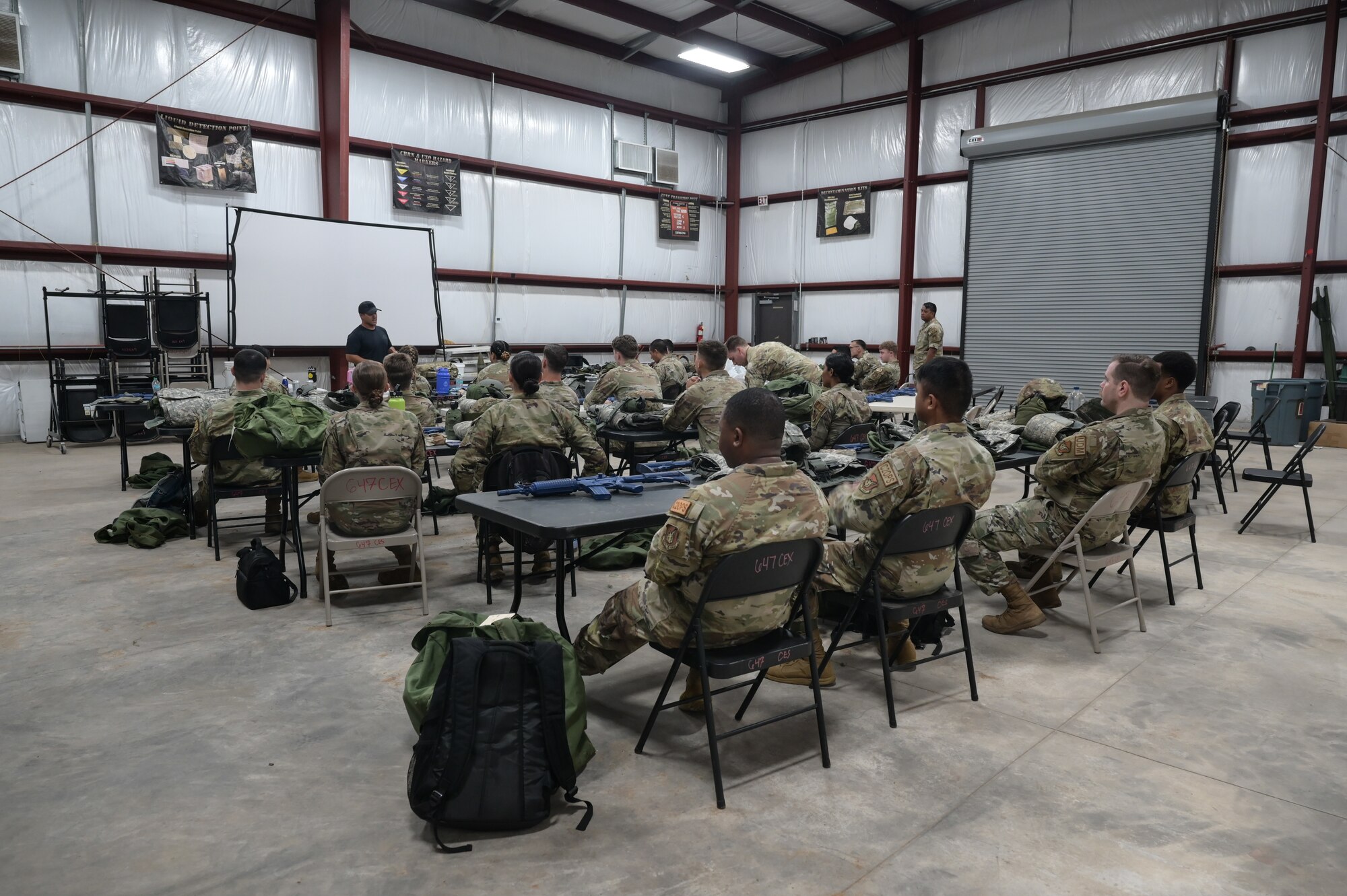 Airmen attend training briefing.