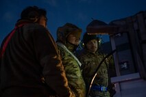 Airmen look at data sheets