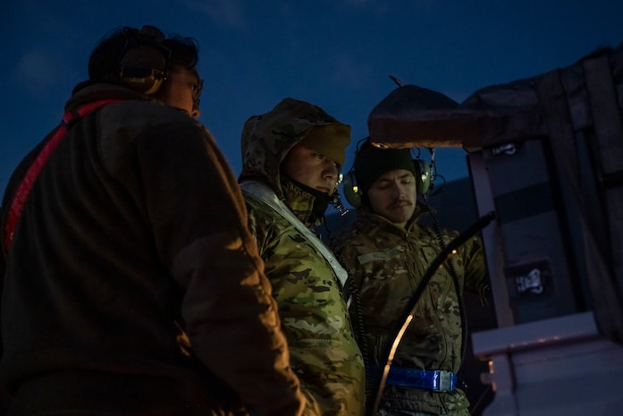 Airmen look at data sheets
