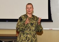 JOINT BASE SAN ANTONIO-FORT SAM HOUSTON – (Nov. 13, 2024) – Capt. Jennifer Buechel, Nurse Corps, of Woodhaven, Mich., commanding officer, Naval Medical Research Unit (NAMRU) San Antonio, addresses research scientists and support staff during the 10th Edition of Mission Possible, an information-sharing event, held at the Tri-Service Research Laboratory. The purpose of Mission Possible is to better inform members of the command on the tactics, techniques, and procedures of the science directorates to include the resource acquisitions and administrative directorates.  NAMRU San Antonio’s mission is to conduct gap driven combat casualty care, craniofacial, and directed energy research to improve survival, operational readiness, and safety of Department of Defense (DoD) personnel engaged in routine and expeditionary operations. It is one of the leading research and development laboratories for the U.S. Navy under the DoD and is one of eight subordinate research commands in the global network of laboratories operating under the Naval Medical Research Command in Silver Spring, Md. (U.S. Navy photo by Burrell Parmer, NAMRU San Antonio Public Affairs/Released)