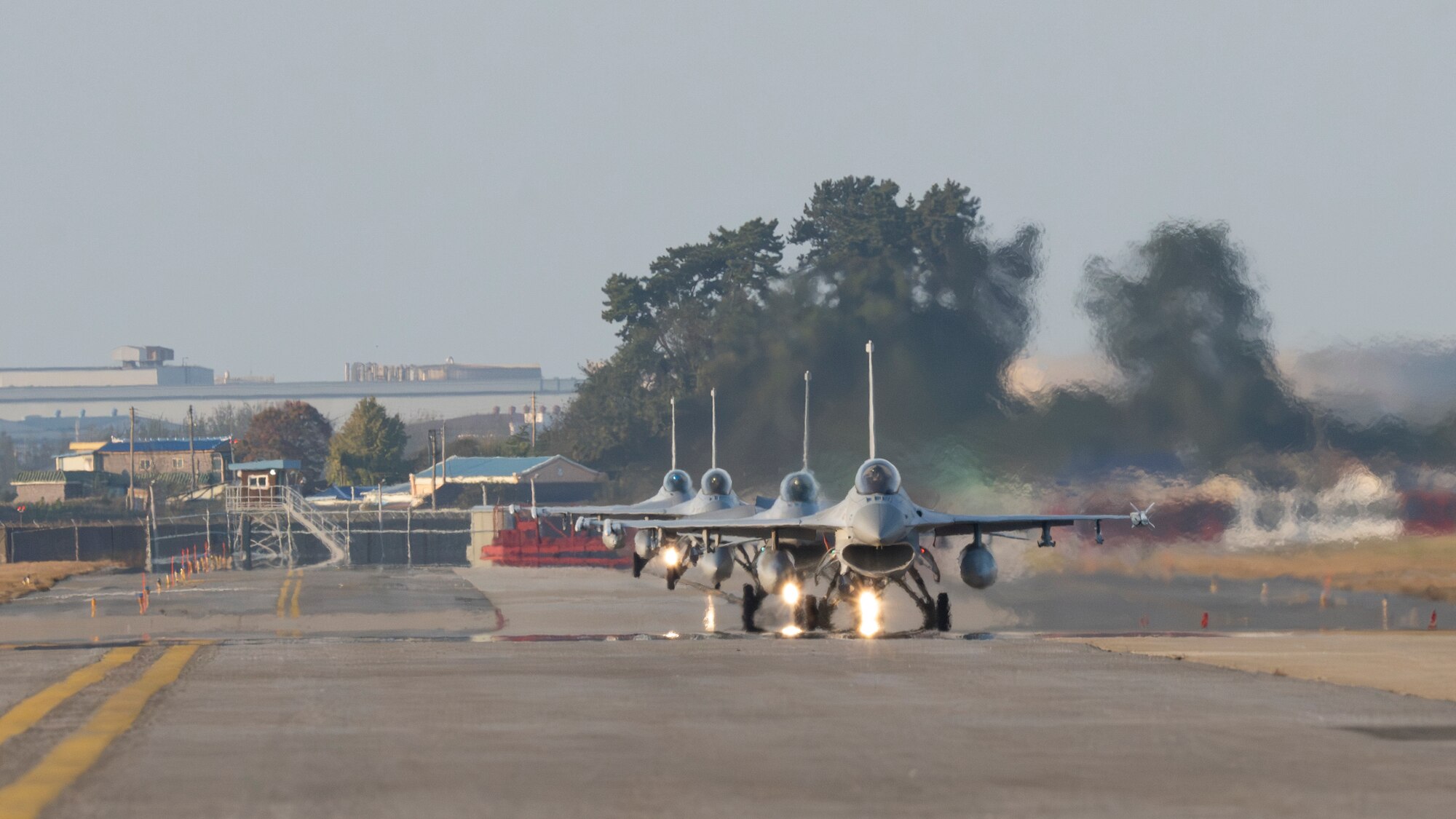 Republic of Korea Air Force KF-16 Fighting Falcons taxi down the flightline for Buddy Squadron 24-6 at Kunsan Air Base, Republic of Korea