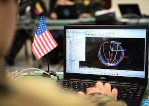 New York Air National Guard 107th Attack Wing space systems operators work through a space scenario during CRUZEX CYBER at Natal Air Force Base, Brazil, Nov. 8, 2024. The training aims to fortify the resilience of critical military infrastructure and strengthen the strategic partnerships within the region. (U.S. Air Force photo by Staff Sgt. Madeline Herzog)