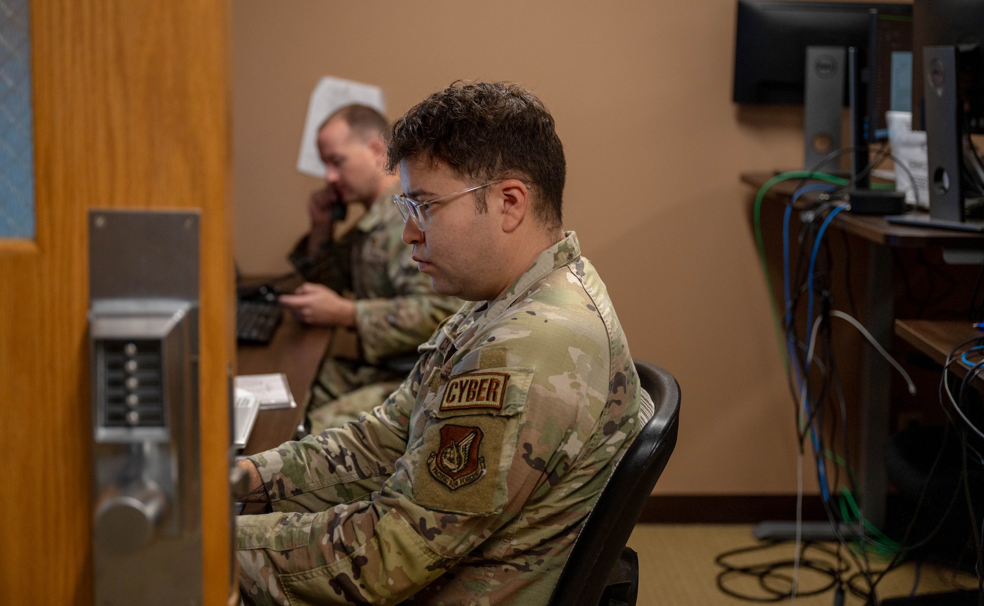 military service member works on computer