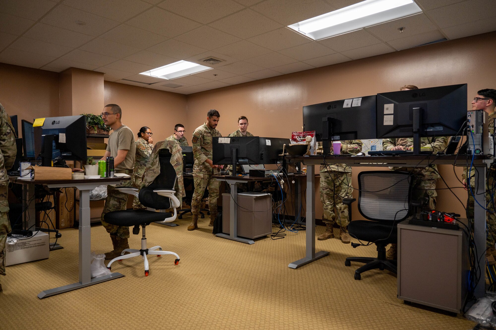 military service members work on computer