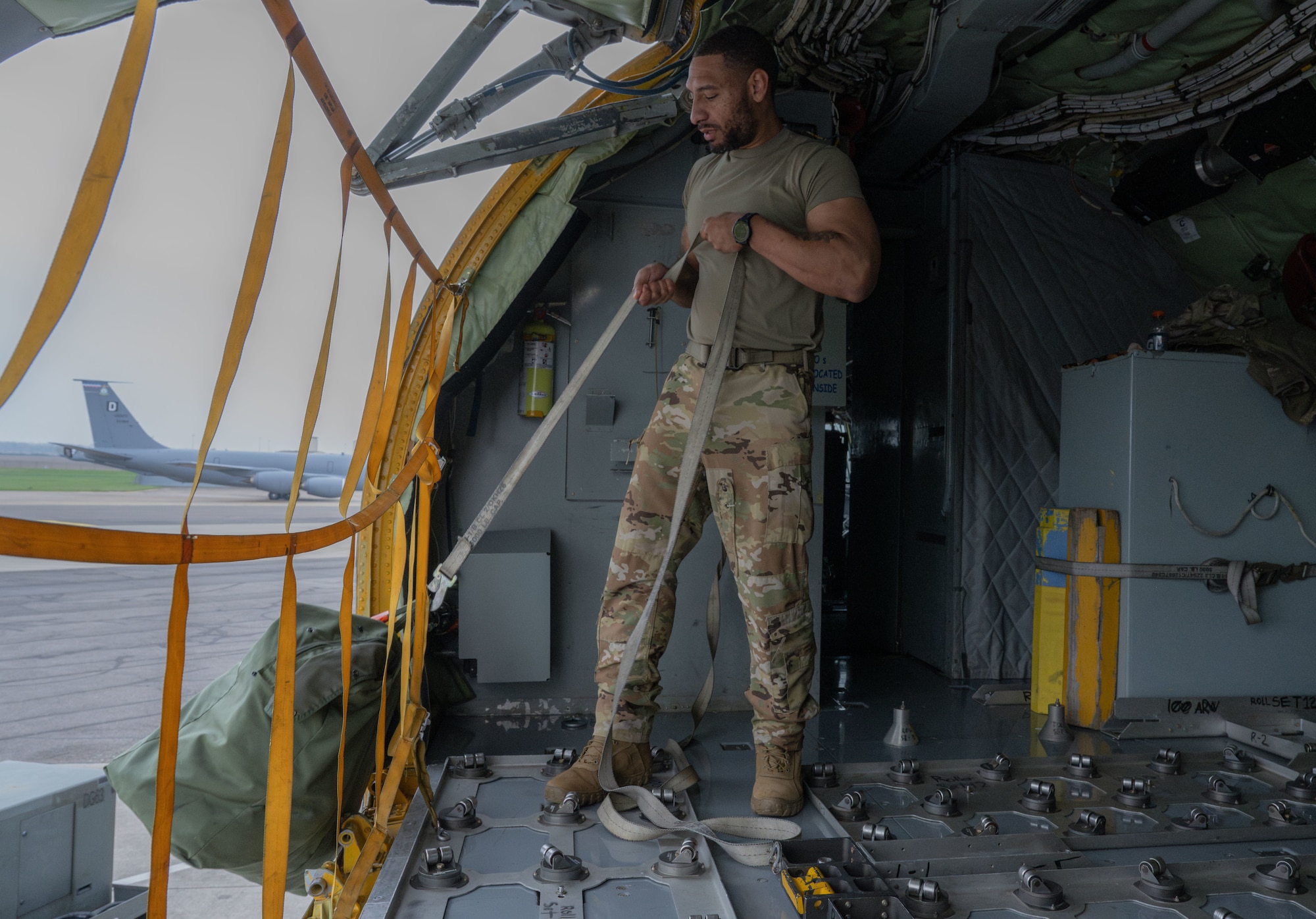 U.S. Air Force Tech. Sgt. Jamar Campbell, 351st Air Refueling Squadron boom operator, loads cargo into a KC-135 Stratotanker at Royal Air Force Mildenhall, England, Nov. 5, 2024.