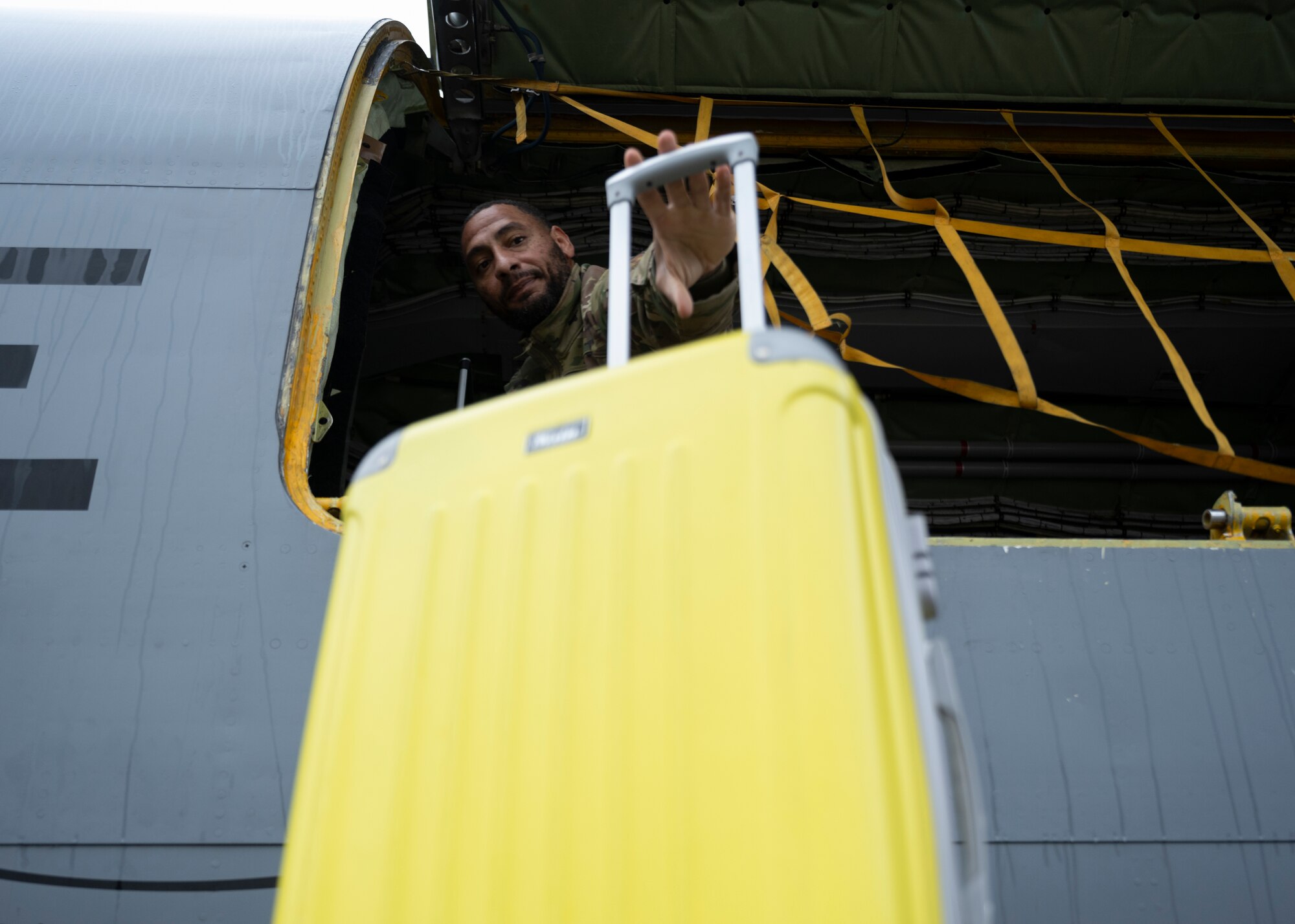 U.S. Air Force Tech. Sgt. Jamar Campbell, 351st Air Refueling Squadron boom operator, loads cargo into a KC-135 Stratotanker at Royal Air Force Mildenhall, England, Nov. 6, 2024.