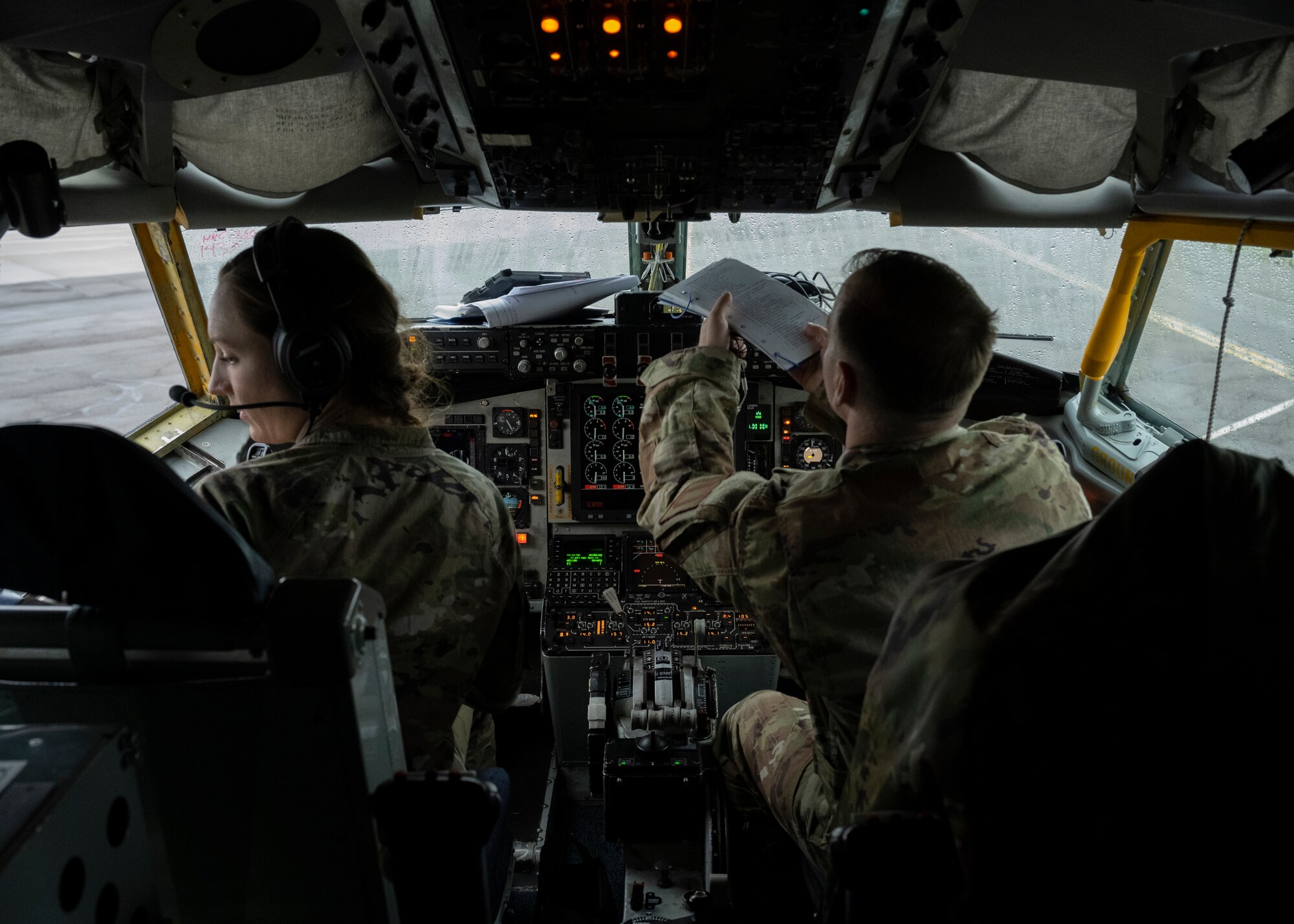 U.S. Air Force Capt. Allison Beech, left, 351st KC-135 Stratotanker pilot and Senior Airman Logan Carson,100th Aircraft Maintenance Squadron heavy integrated aircraft avionics journeyman, perform pre-flight checks at Royal Air Force Mildenhall, England, Nov. 6, 2024.