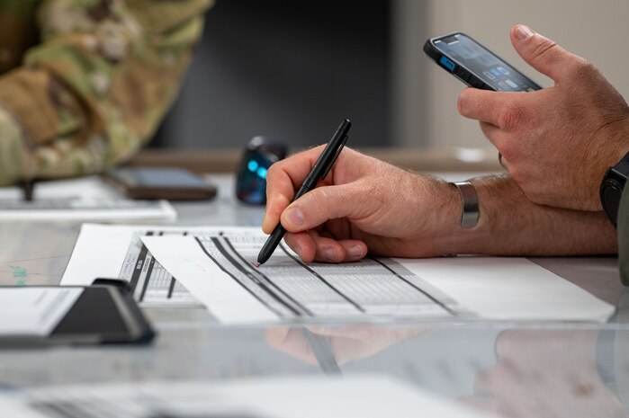 U.S. Air Force Chief Master Sgt. Danny South, 16th Airlift Squadron senior enlisted leader, takes notes during mission planning for Battalion Mass Tactical Week at Fort Liberty, North Carolina, Nov. 13, 2024.