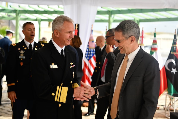 Vice Adm. Jeffrey Anderson, commander, U.S. 6th Fleet, (left) and Joey Hood, U.S. Ambassador of Tunisia, (right) Shake hands during the closing ceremony for Phoenix Express 2024 in Tunis, Tunisia, Nov. 15, 2024.