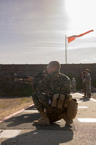 U.S. Marine Corps Rct. Espinoza Josiah with Kilo Company, 3rd Recruit Training Battalion, looks down range during the table one course of fire at Marine Corps Base Camp Pendleton, California, Nov. 6, 2024. Table one covers the basic fundamentals of marksmanship and rifle safety in all shooting positions: sitting, kneeling, and the prone. (U.S. Marine Corps photo by Lance Cpl. Janell B. Alvarez)