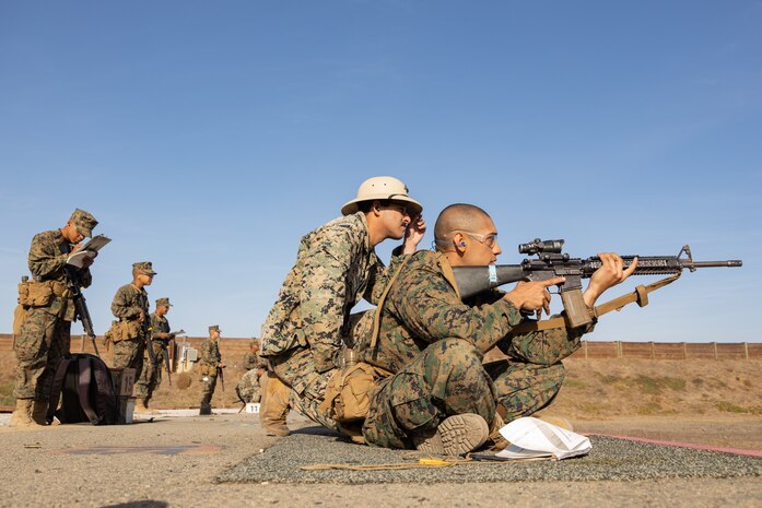 A U.S. Marine Corps Recruit with Kilo Company, 3rd Recruit Training Battalion, receives instruction during the table one course of fire at Marine Corps Base Camp Pendleton, California, Nov. 6, 2024. Table one covers the basic fundamentals of marksmanship and rifle safety in all shooting positions: sitting, kneeling, and the prone. (U.S. Marine Corps photo by Lance Cpl. Janell B. Alvarez)