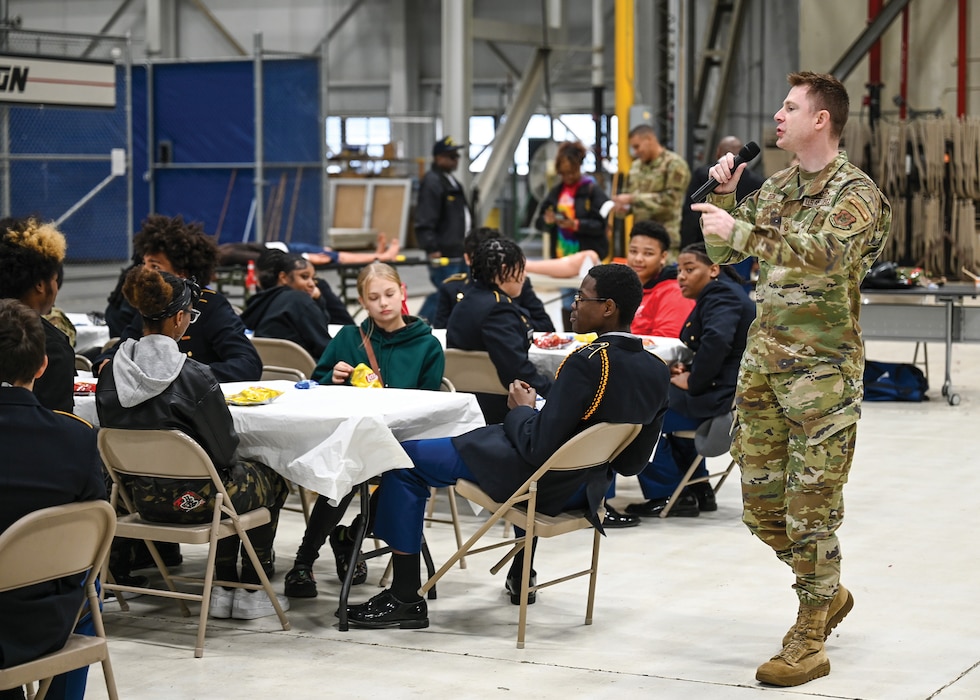 Master Sgt. Frederick Geck, 445 Airlift Wing recruiter, briefs students from Meadowdale Career Technology Center about the Air Force and answers questions about potential career paths, enlistment requirements, physical fitness standards, specific Air Force roles and educational opportunities Oct. 18, 2024. During their visit to the wing, the students toured a C-17 Globemaster III aircraft and participated in demonstrations with the 445th ASTS, 445th Aerospace Medicine Squadron and 445th Security Forces Squadron.