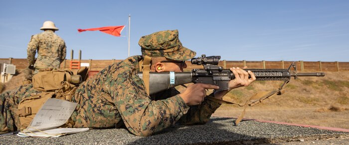 U.S. Marine Corps Rct. Michael Graziano with Kilo Company, 3rd Recruit Training Battalion, sights in at a target during the table one course of fire at Marine Corps Base Camp Pendleton, California, Nov. 6, 2024. Table one covers the basic fundamentals of marksmanship and rifle safety in all shooting positions: sitting, kneeling, and the prone. (U.S. Marine Corps photo by Lance Cpl. Janell B. Alvarez)