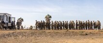 U.S. Marine Corps recruits with Kilo Company, 3rd Recruit Training Battalion, wait to receive ammunition during the table one course of fire at Marine Corps Base Camp Pendleton, California, Nov. 6, 2024. Table one covers the basic fundamentals of marksmanship and rifle safety in all shooting positions: sitting, kneeling, and the prone. (U.S. Marine Corps photo by Lance Cpl. Janell B. Alvarez)