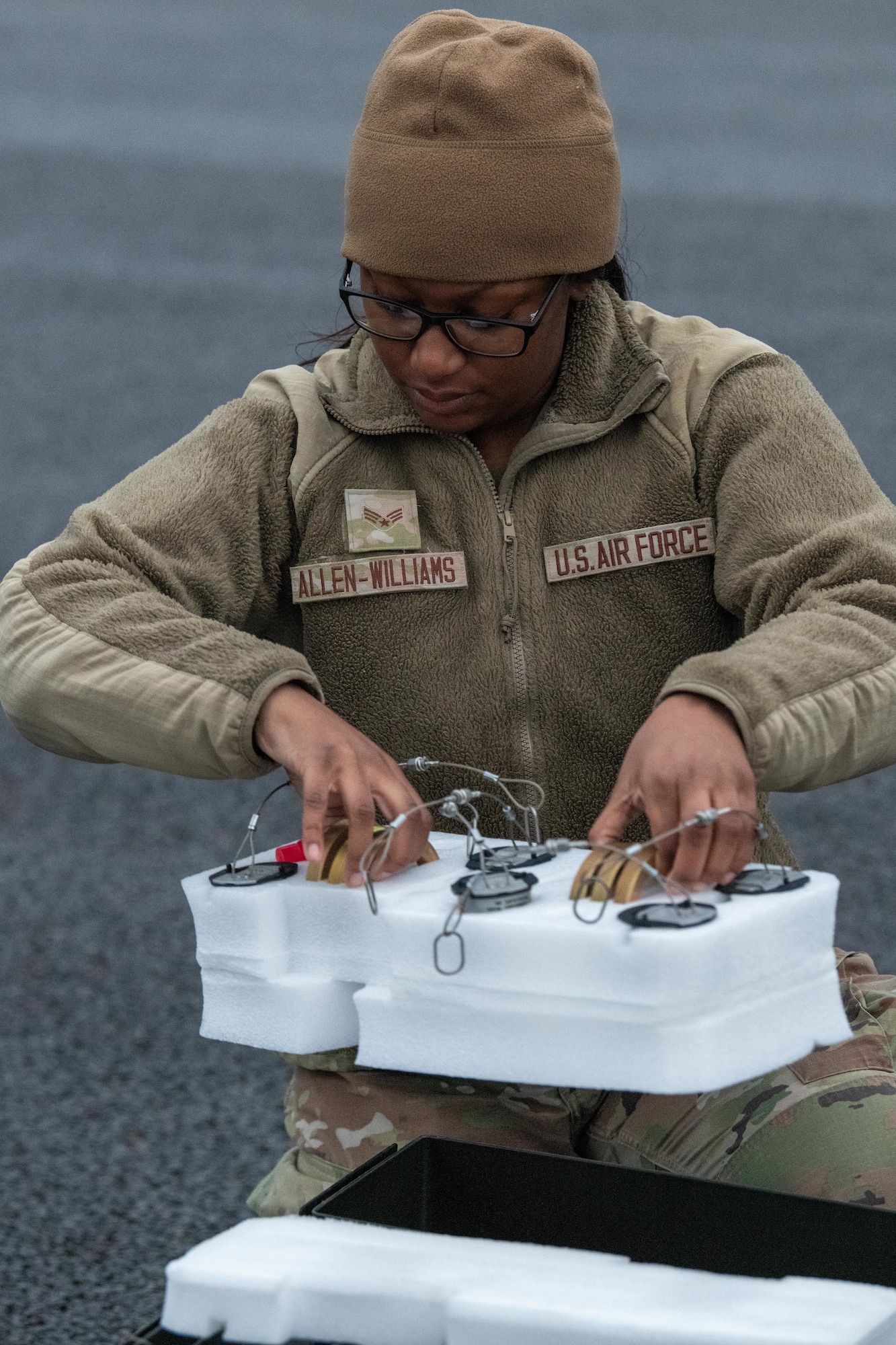 Airman transfers FMU-139 fuses in preparation of building GBU-38 Joint Direct Attack Munitions