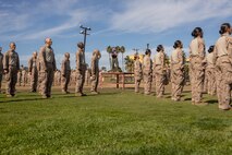 U.S. Marine Corps Staff Sgt. Rudy Dominguez, chief drill instructor with Lima Company, 3rd Recruit Training Battalion, leads recruits in conducting dynamic warm-ups prior to the introduction of the combat fitness test at Marine Corps Recruit Depot San Diego, California, Oct 30, 2024. The recruits were introduced to the CFT by conducting different portions of the test separately. The CFT is an annual fitness test that is required of all Marines to pass and maintain consisting of an 880-yard sprint, ammunition can lifts, and a maneuver under fire drill. (U.S. Marine Corps photo by Lance Cpl. Janell B. Alvarez)