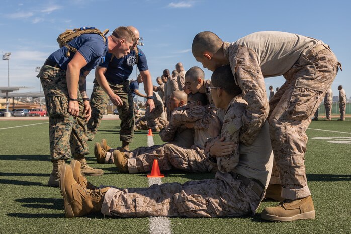 U.S. Marine Corps recruits with Lima Company, 3rd Recruit Training Battalion, execute the buddy drag during the maneuver under fire portion of the combat fitness test event at Marine Corps Recruit Depot San Diego, California, Oct. 30, 2024. The CFT is a test that all recruits must pass and maintain once a year to assess combat readiness as well as physical conditioning. (U.S. Marine Corps photo by Lance Cpl. Janell B. Alvarez)