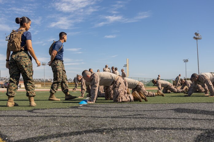 U.S. Marine Corps recruits with Lima Company, 3rd Recruit Training Battalion, execute a high crawl during the maneuver under fire portion of the combat fitness test event at Marine Corps Recruit Depot San Diego, California, Oct. 30, 2024. The CFT is a test that all recruits must pass and maintain once a year to assess combat readiness as well as physical conditioning. (U.S. Marine Corps photo by Lance Cpl. Janell B. Alvarez)