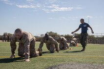 U.S. Marine Corps recruits with Lima Company, 3rd Recruit Training Battalion, execute a high crawl during the maneuver under fire portion of the combat fitness test event at Marine Corps Recruit Depot San Diego, California, Oct. 30, 2024. The CFT is a test that all recruits must pass and maintain once a year to assess combat readiness as well as physical conditioning. (U.S. Marine Corps photo by Lance Cpl. Janell B. Alvarez)