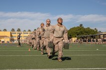 U.S. Marine Corps recruits with Lima Company, 3rd Recruit Training Battalion, execute an ammunition can run during the maneuver under fire portion of the combat fitness test event at Marine Corps Recruit Depot San Diego, California, Oct. 30, 2024. The CFT is a test that all recruits must pass and maintain once a year to assess combat readiness as well as physical conditioning. (U.S. Marine Corps photo by Lance Cpl. Janell B. Alvarez)
