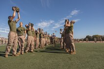 U.S. Marine Corps recruits with Lima Company, 3rd Recruit Training Battalion, execute the ammunition can lift portion of a combat fitness test event at Marine Corps Recruit Depot San Diego, California, Oct. 30, 2024. The CFT is a test that all recruits must pass and maintain once a year to assess combat readiness as well as physical conditioning. (U.S. Marine Corps photo by Lance Cpl. Janell B. Alvarez)