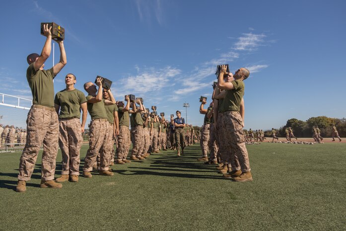 U.S. Marine Corps recruits with Lima Company, 3rd Recruit Training Battalion, execute the ammunition can lift portion of a combat fitness test event at Marine Corps Recruit Depot San Diego, California, Oct. 30, 2024. The CFT is a test that all recruits must pass and maintain once a year to assess combat readiness as well as physical conditioning. (U.S. Marine Corps photo by Lance Cpl. Janell B. Alvarez)