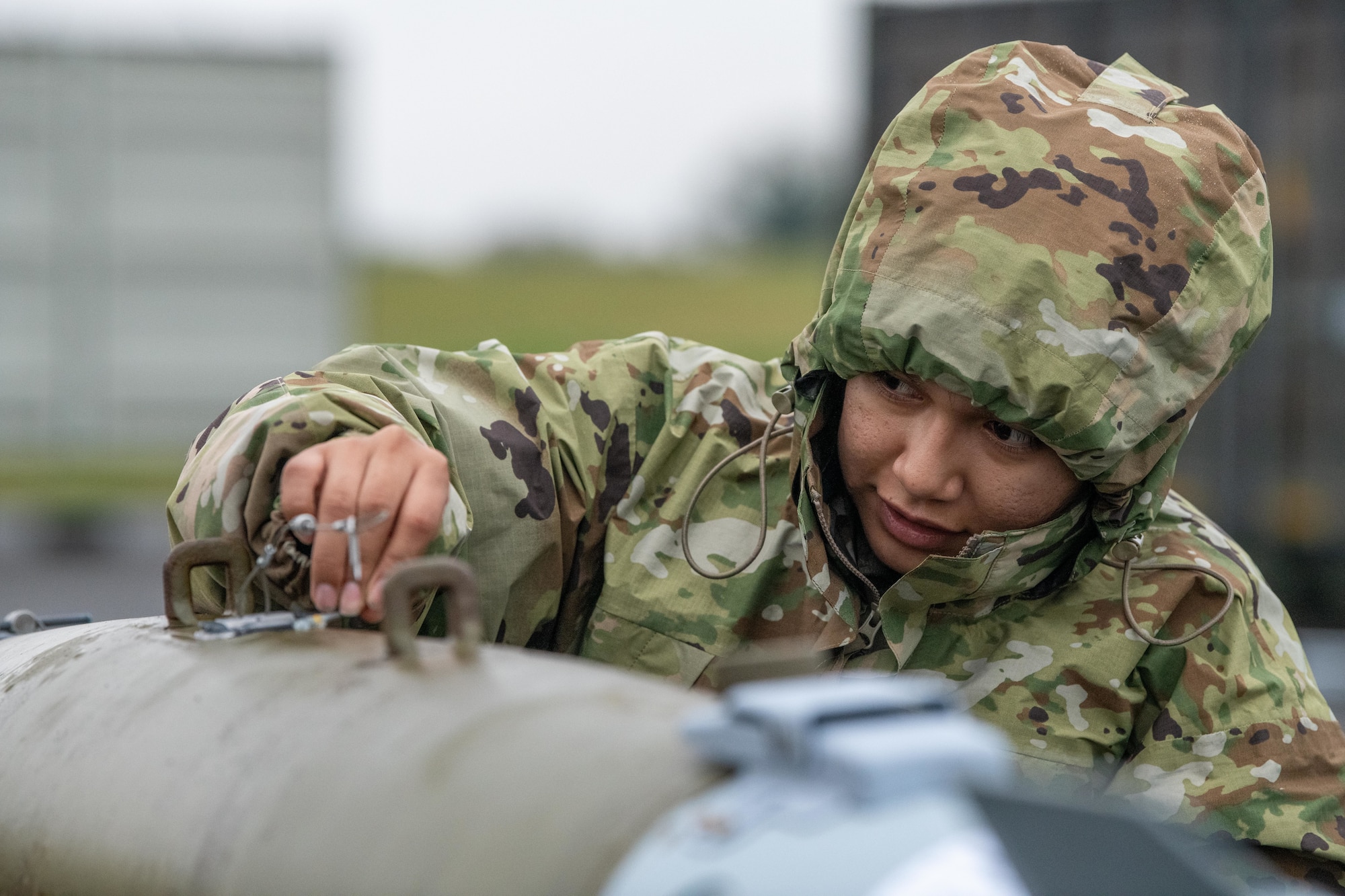 Airman applies room temperature vulcanization to a GBU-38 Joint Direct Attack Munitions
