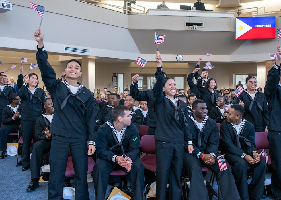 Recruits take the Oath of Allegiance to the United States of America during a naturalization ceremony in the Recruit Memorial Chapel at Recruit Training Command.