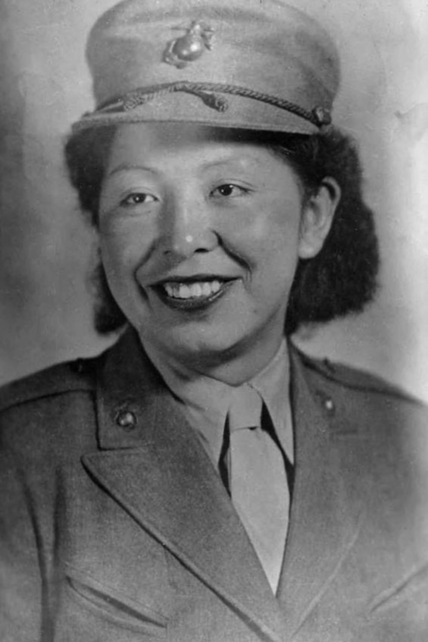 A female Marine is pictured in uniform.