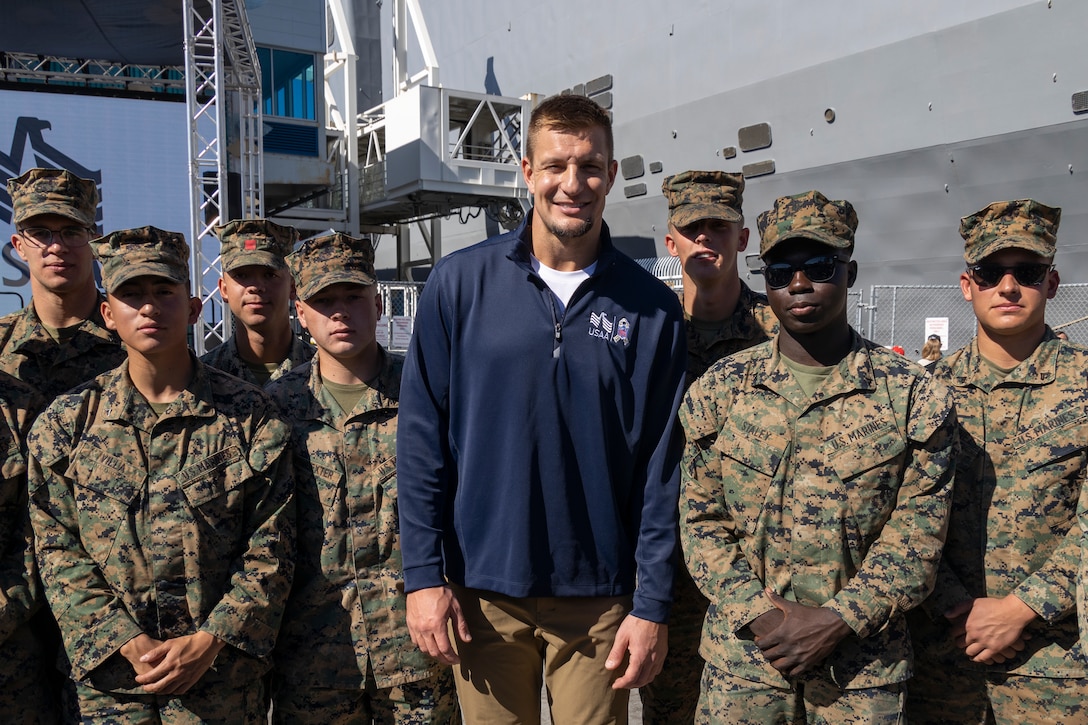 Rob Gronkowski, a former National Football League player, poses for a photo with U.S. Marines during Fleet Week San Diego at Broadway Pier, San Diego, Nov. 9, 2024. FWSD is an opportunity for San Diego residents and tourists to meet their Navy, Marine Corps and Coast Guard teams and experience America’s sea services. During fleet week, service members participate in various community relations events, showcase capabilities and equipment to the community, and enjoy the hospitality of San Diego and the surrounding area. (U.S. Marine Corps photo by Sgt. Gabriel Tavarez)
