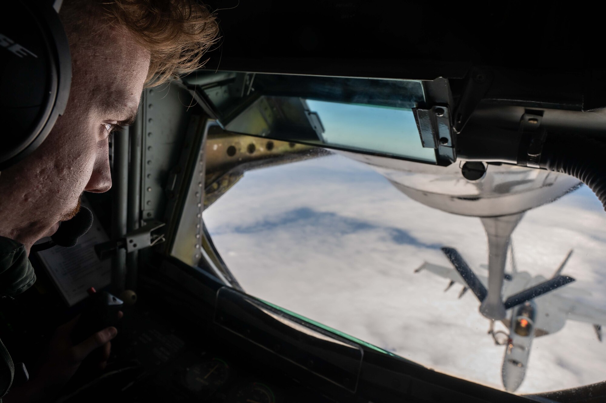 Aerial view of a military aircraft refueling.