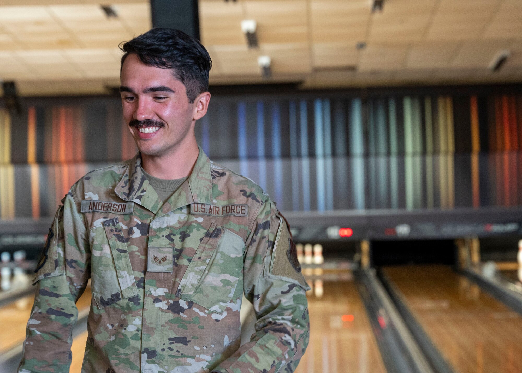 A U.S. Airman walks toward his seat while bowling at Davis-Monthan Air Force Base, Arizona, Nov. 13, 2024. The Airman was one of many who participated in Airman’s Week, a week of free events organized by base leadership for Airmen to network and improve morale. (U.S. Air Force photo by Senior Airman William Finn V)