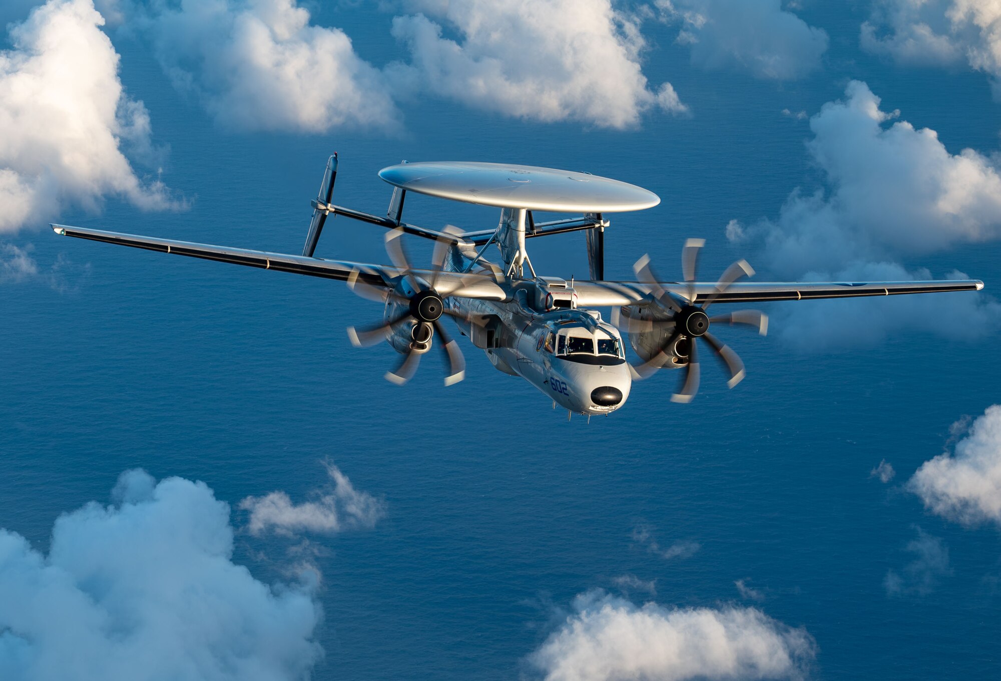 A U.S. Navy E-2D Advanced Hawkeye aircraft assigned to the VAW-121 Bluetails flies through the air